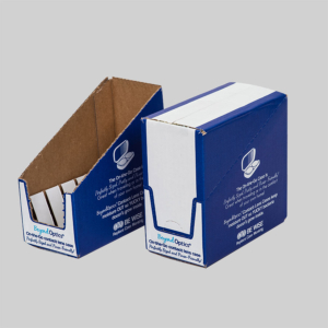 Two blue and white cardboard boxes are shown. One is open with dividers, revealing eyeglass cases inside, while the other remains closed. Both packages are labeled "Beyond Optics" and feature eyeglass graphics. The background is a plain, light grey.