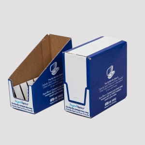 Two blue cardboard packaging boxes are shown side by side, one fully enclosed and the other open. Featuring electronic gadget-related graphics, these shipping boxes indicate they are smartphone cases from "Beyond Optics." The open box reveals a white case inside.