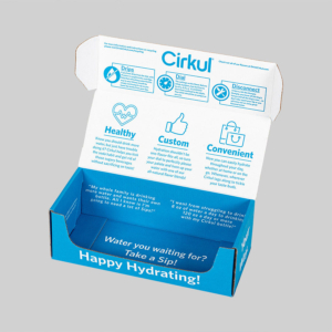 A blue and white partially open Cirkul branded shipping box. Inside, the word "Cirkul" appears at the top, with graphics and text describing product features: Healthy, Custom, Convenient. The bottom reads, "Water you waiting for? Take a sip! Happy Hydrating!".