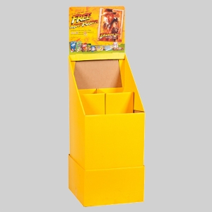 A bright yellow cardboard display stand with an attached header showcasing sharp graphics and offers for a free movie poster. The stand has multiple compartments for holding items but is currently empty, resembling the organized efficiency of a shipping container. The background is plain gray.