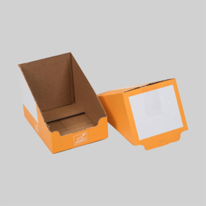 Two orange and white packaging boxes are pictured against a gray background. One box is upright and open, showing the interior space, while the other is lying flat with the open side facing down. Both boxes have a printed label reading "Lidderik.