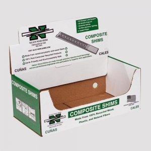 An open cardboard box labeled "Nelson Wood Shims Composite Shims" with green and white text. The packaging details the product as being made from 100% recycled wood, plastic, and natural fibers, highlighting environmental benefits and ease of use.