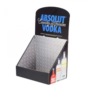 A black and silver display stand for Absolut Vodka. The top part reads "Absolut Country of Sweden Vodka" in blue and white text. The front panel features sharp graphics of three different Absolut Vodka bottles. The stand is empty, ready for packaging.