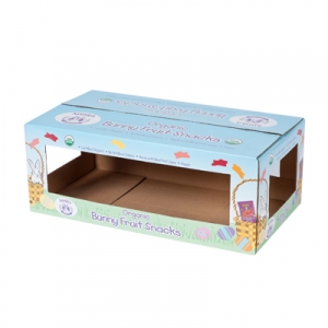 An empty blue cardboard box labeled "Organic Bunny Fruit Snacks" features sharp graphics of bunnies, carrots, and flowers. The packaging has rectangular cutouts on the sides, revealing the hollow interior. It is labeled "USDA Organic" and "Vegan.