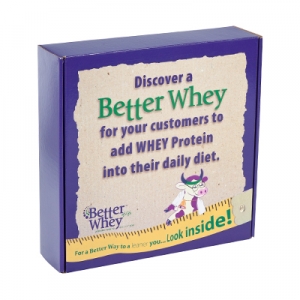 A product box with sharp graphics: "Discover a Better Whey for your customers to add WHEY Protein into their daily diet." The box is primarily purple, featuring a cartoon cow holding a glass on the front. The bottom text reads: "For a better way to a leaner you... Look inside!