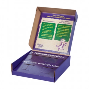 An open cardboard display box with a purple interior and text promoting Better Whey protein, perfect for a subscription box. The inside cover lists the benefits of whey protein. The bottom section has slots for holding product samples, labeled with "5 Delicious Varieties.