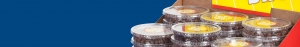 Close-up of multiple clear plastic containers filled with chocolate sprinkles, neatly stacked in a display box. The sharp graphics on the packaging stand out against the solid blue background.