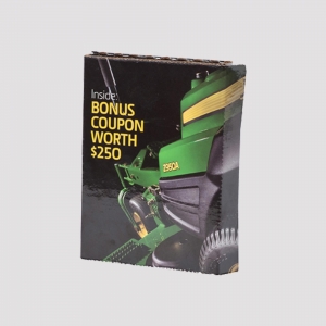 A cardboard box with sharp graphics displaying a green and yellow lawnmower, model "Z950A," and promotional text that reads "Inside: BONUS COUPON WORTH $250." The packaging stands upright against a plain white background.