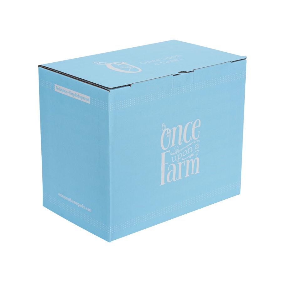 A light blue cardboard package with the text "Once Upon a Farm" printed in white, using a playful, whimsical font. The packaging appears to be closed and features sharp graphics, with a website URL at the bottom that is partially visible.