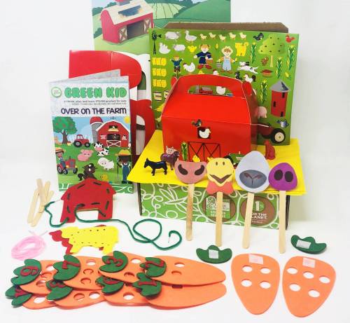 An assortment of farm-themed craft materials and activity items are displayed, featuring sharp graphics including a red barn cutout, foam carrot cutouts with holes, fruit and vegetable sticks, green strings, and a booklet titled "Over on the Farm." A green box serves as the package.