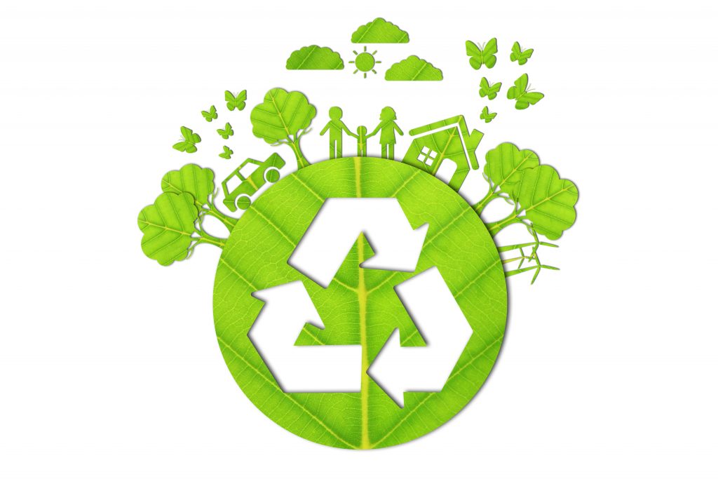 A green leaf forms the background for a recycling symbol. Surrounding the leaf are sharp graphics of people holding hands, trees, a house, a car, butterflies, and birds, representing environmental sustainability and community.