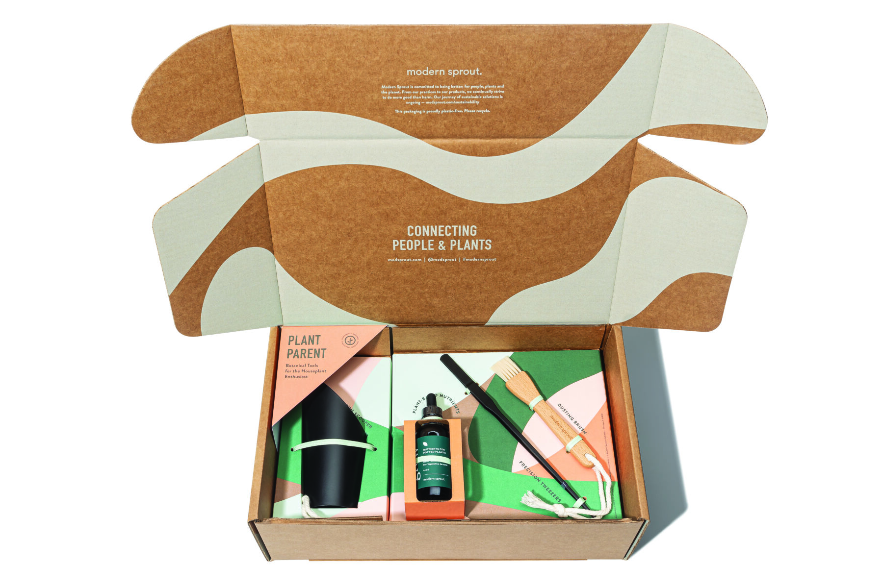 A modern sprout box is opened to reveal various plant care items, including a plant parent book, a spray bottle, a small brush, and a watering tool. The packaging's lid features green and white abstract shapes and the words "CONNECTING PEOPLE & PLANTS".