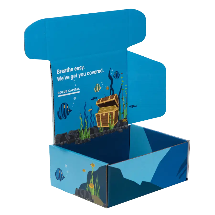 An open cardboard box with a blue interior featuring colorful underwater graphics, including fish, seaweed, and a treasure chest. Text on the inside lid reads, "Breathe easy. We've got you covered. GOLUB CAPITAL." The package exterior is also blue with similar brand designs showcasing aquatic graphics.