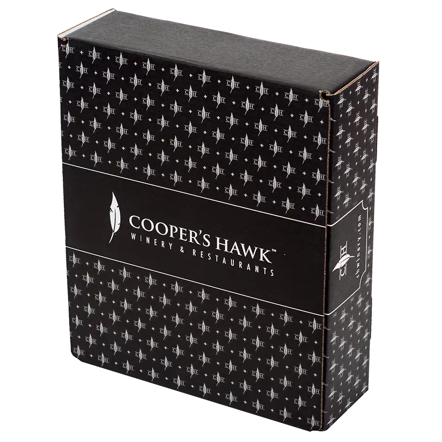 A black Cooper's Hawk Winery & Restaurants gift box with a repeating pattern of the Cooper's Hawk logo. The packaging features the Cooper's Hawk name and logo prominently in white on the front, showcasing its elegant graphics.