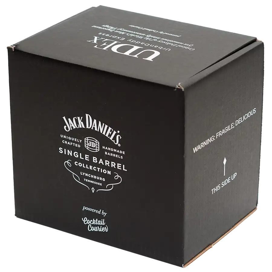 A black cardboard box labeled "Jack Daniel's Single Barrel Collection" with "Cocktail Courier" noted underneath. The packaging features "Warning: Fragile, Delicious" and "This Side Up" text on the side.