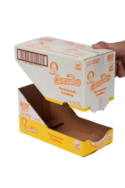 Hand opening a yellow cardboard box of Gerber Graduates Arrowroot Cookies